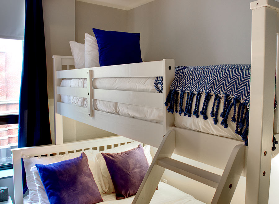 Bunkbeds with purple pillows